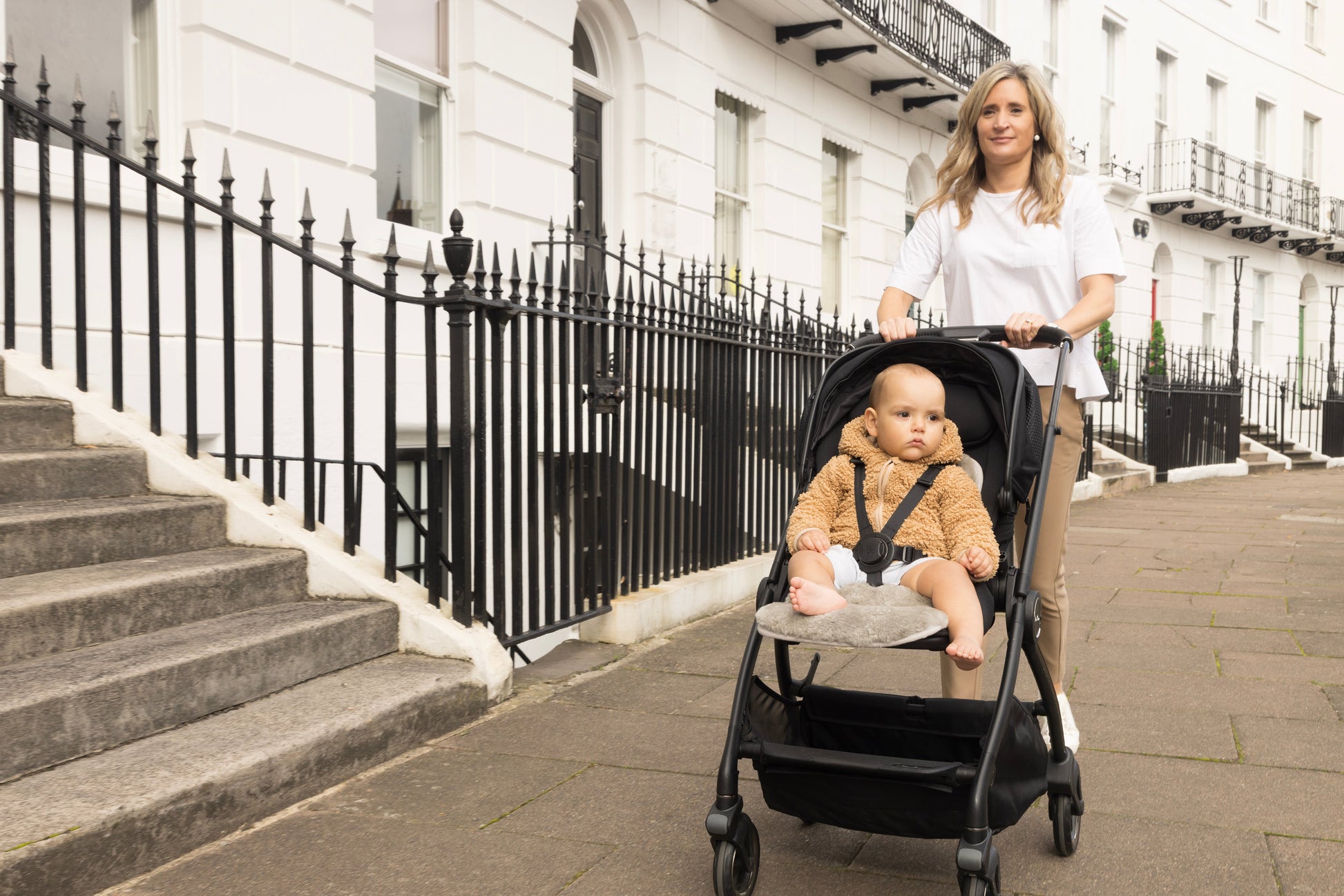 sheepskin pram liner 100% cotton backing grey baby in pushchair in City